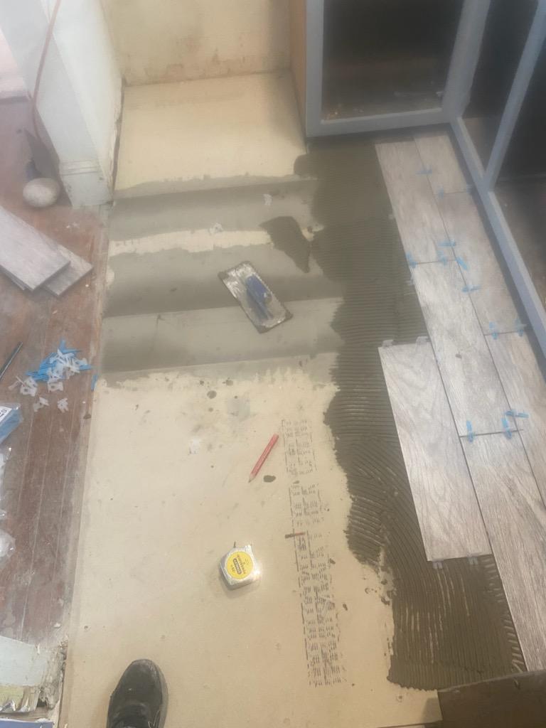 Floor Tile Installation in Progress