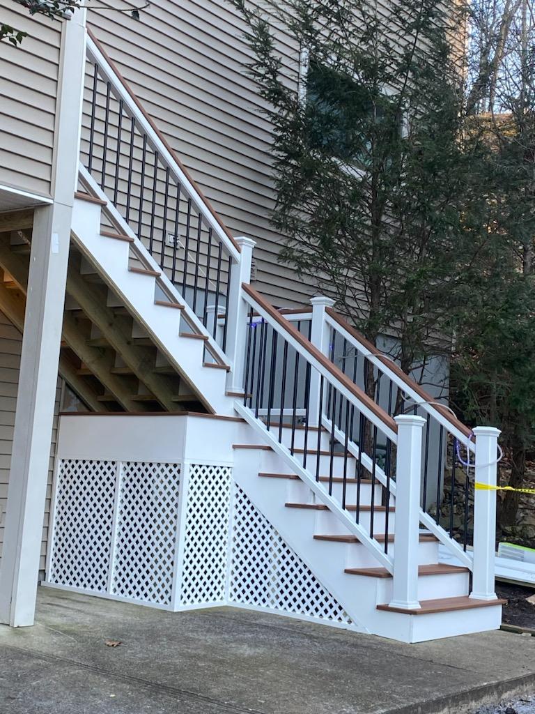 Outdoor Deck with White Lattice Railing Skirt